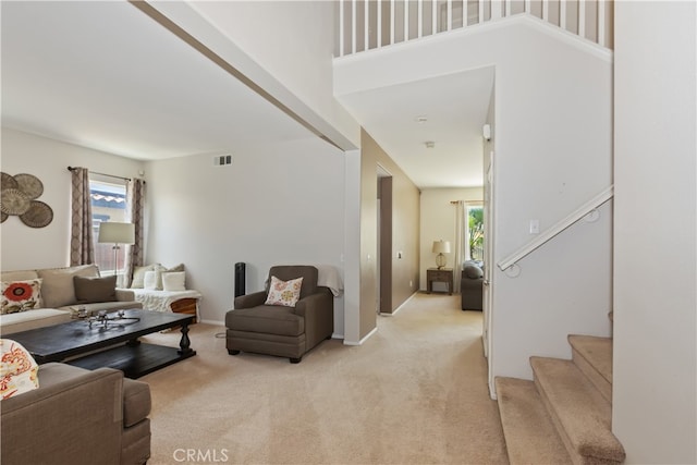 213 Caldera St, Perris, CA 92570 - living room featuring plenty of natural light, light carpet, and stairway