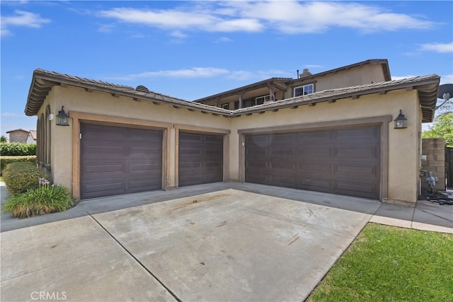 213 Caldera St, Perris, CA 92570 - view of front of house with stucco siding, concrete driveway, and a garage