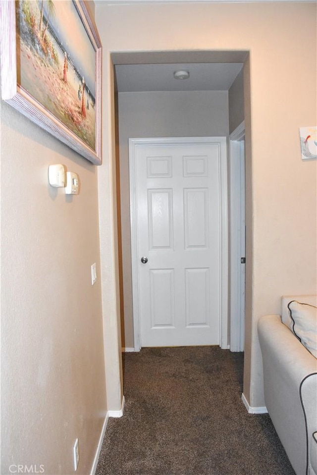 12655 Verano St, Victorville, CA 92392 - hallway with carpet and baseboards