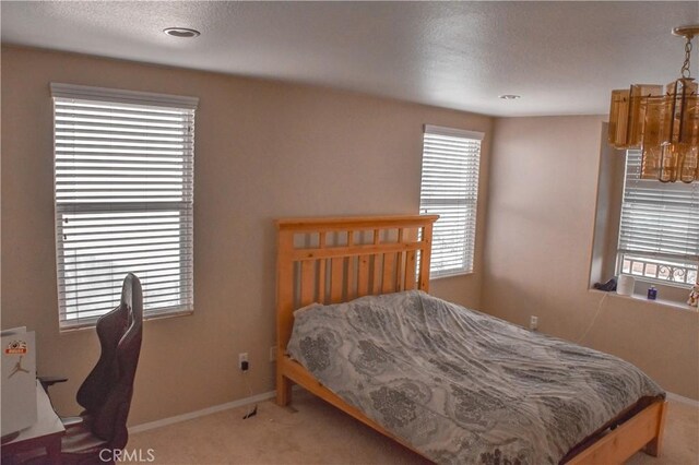 12655 Verano St, Victorville, CA 92392 - carpeted bedroom with baseboards