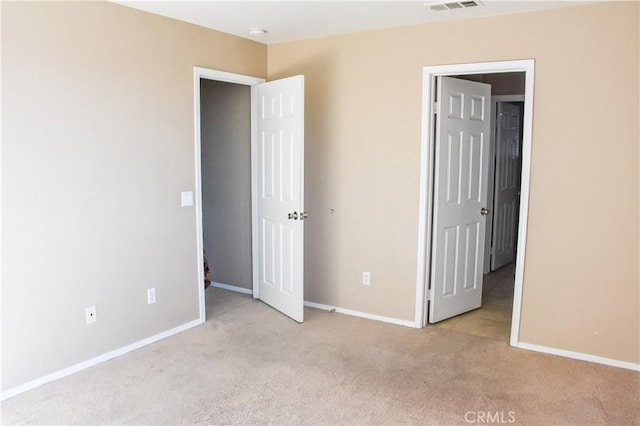 12655 Verano St, Victorville, CA 92392 - unfurnished bedroom featuring light colored carpet and baseboards