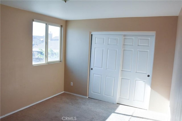 12655 Verano St, Victorville, CA 92392 - unfurnished bedroom featuring carpet floors, a closet, and baseboards