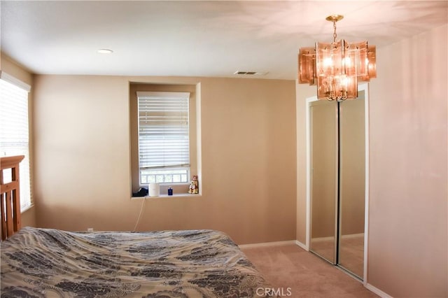 12655 Verano St, Victorville, CA 92392 - bedroom featuring a chandelier, carpet, and baseboards