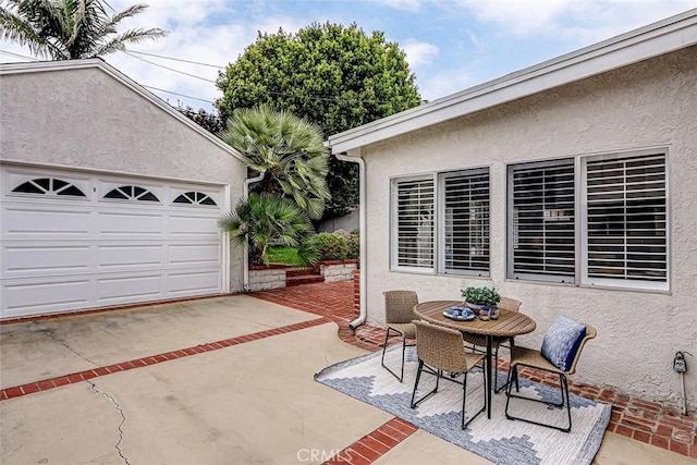 1217 S Gertruda Ave, Redondo Beach, CA 90277 - view of patio / terrace with outdoor dining area and a garage
