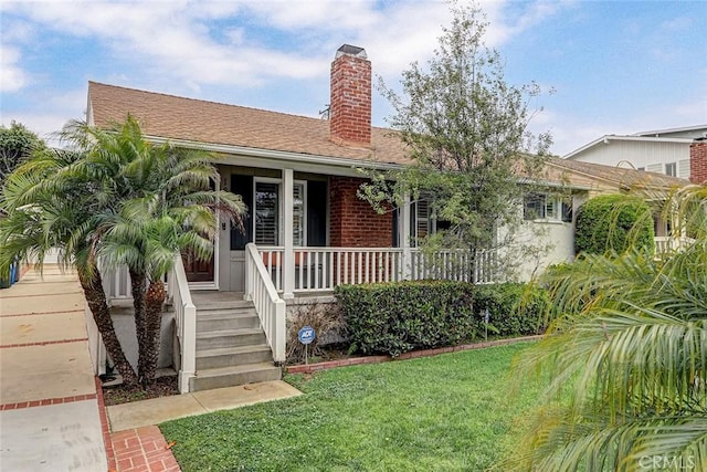 1217 S Gertruda Ave, Redondo Beach, CA 90277 - single story home with a porch, a chimney, a front yard, and brick siding