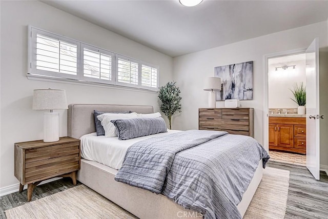 1217 S Gertruda Ave, Redondo Beach, CA 90277 - bedroom featuring wood finished floors, baseboards, ensuite bathroom, and a sink