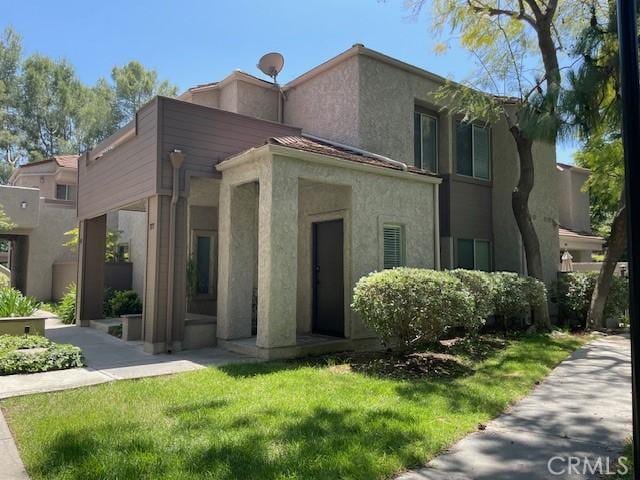 177 Via Colinas, Westlake Village, CA 91362 - view of front facade with a front lawn and stucco siding