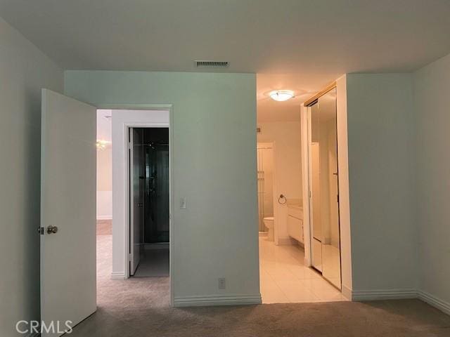 177 Via Colinas, Westlake Village, CA 91362 - unfurnished bedroom with light colored carpet, a spacious closet, and ensuite bathroom