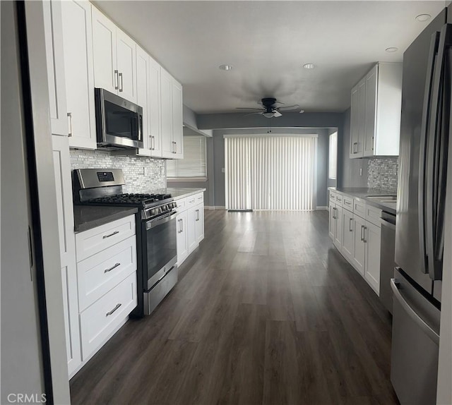 1227 N Fairvalley Ave, Covina, CA 91722 - kitchen featuring appliances with stainless steel finishes, a ceiling fan, backsplash, dark wood-style floors, and white cabinets