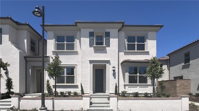 110 Sunnyside, Irvine, CA 92618 - view of front facade featuring stucco siding