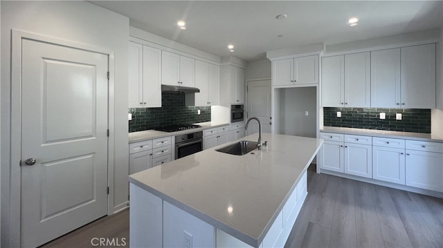 110 Sunnyside, Irvine, CA 92618 - kitchen featuring a sink, oven, under cabinet range hood, black stovetop, and recessed lighting