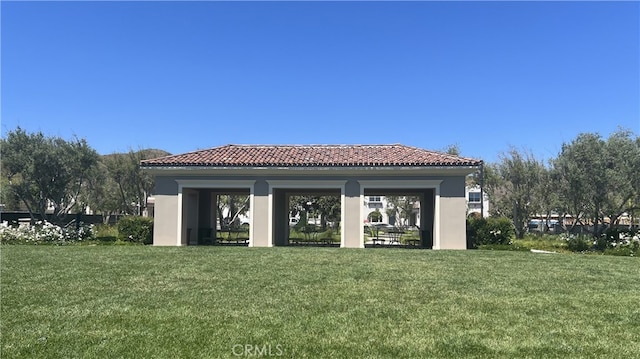 110 Sunnyside, Irvine, CA 92618 - back of property with a tiled roof, stucco siding, and a yard