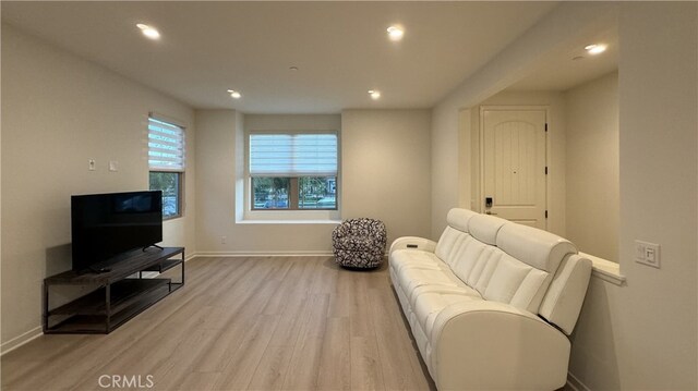 110 Sunnyside, Irvine, CA 92618 - living area with light wood-style flooring, baseboards, and recessed lighting