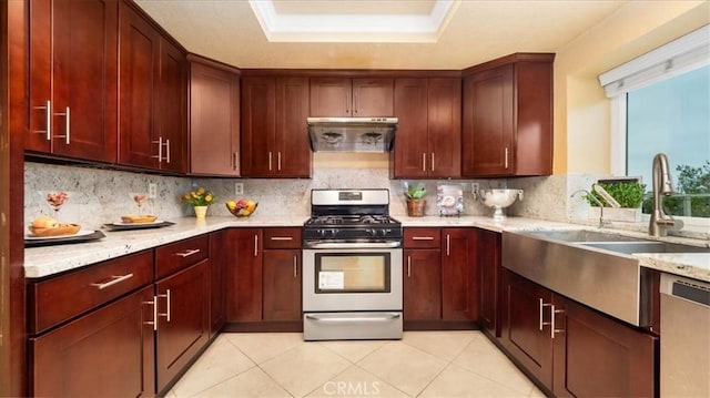 2210 Olympic View Dr, Chino Hills, CA 91709 - kitchen with appliances with stainless steel finishes, extractor fan, tasteful backsplash, light stone counters, and a tray ceiling