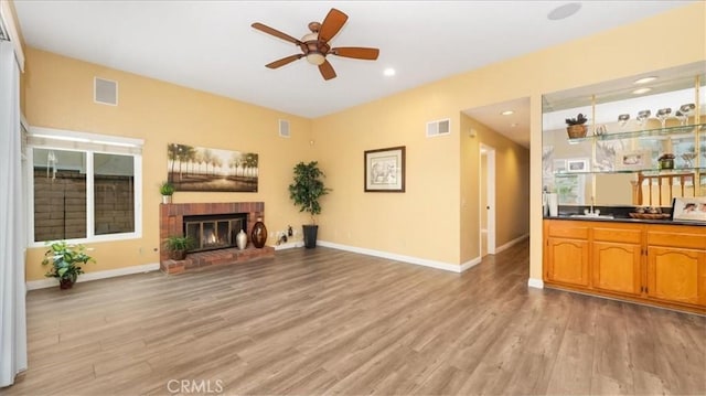 2210 Olympic View Dr, Chino Hills, CA 91709 - unfurnished living room featuring ceiling fan, light wood finished floors, a fireplace, recessed lighting, and baseboards