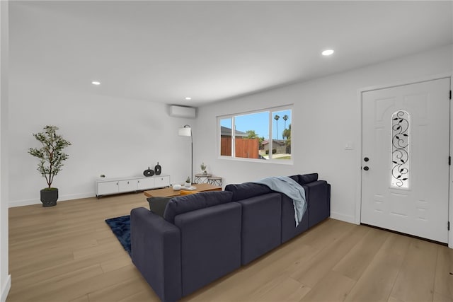 1152 W Tudor St, San Dimas, CA 91773 - living area featuring light wood-style flooring, an AC wall unit, recessed lighting, and baseboards
