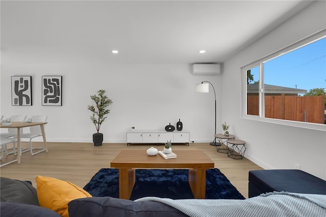 1152 W Tudor St, San Dimas, CA 91773 - living room featuring an AC wall unit, wood finished floors, recessed lighting, and baseboards
