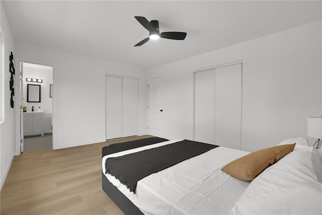 1152 W Tudor St, San Dimas, CA 91773 - bedroom with multiple closets, light wood-type flooring, connected bathroom, and ceiling fan