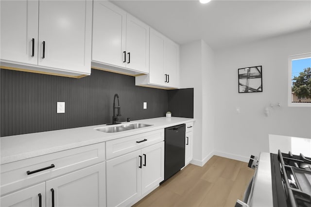 1152 W Tudor St, San Dimas, CA 91773 - kitchen with a sink, black dishwasher, range with gas stovetop, light wood-type flooring, and light countertops