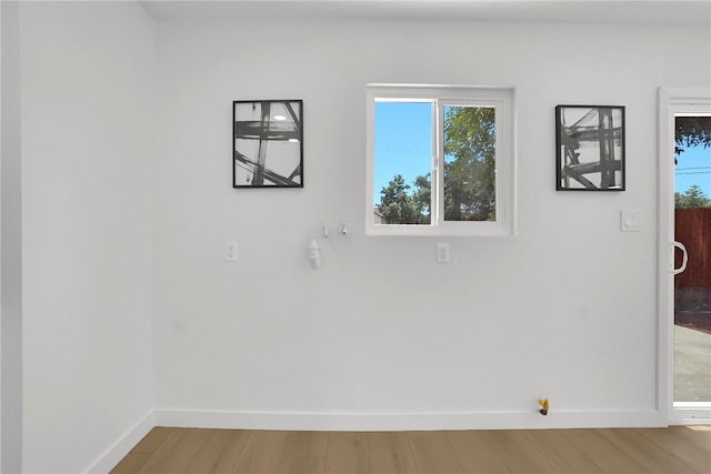 1152 W Tudor St, San Dimas, CA 91773 - empty room with baseboards, wood finished floors, and healthy amount of natural light