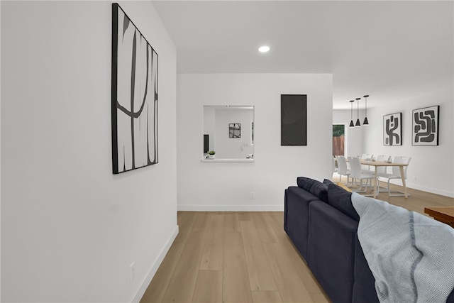 1152 W Tudor St, San Dimas, CA 91773 - living room with light wood finished floors, recessed lighting, and baseboards