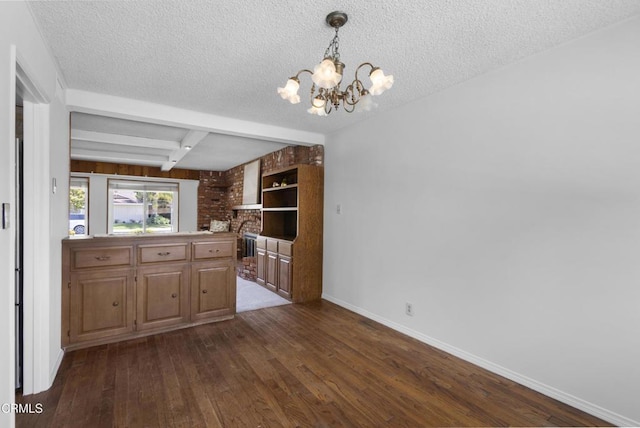 6421 Almar St, Simi Valley, CA 93063 - kitchen featuring a textured ceiling, dark wood finished floors, a chandelier, beamed ceiling, and pendant lighting