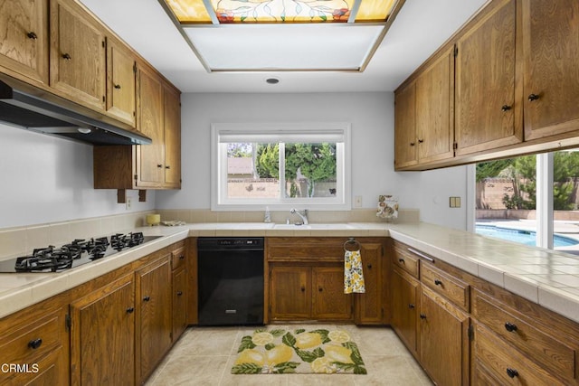 6421 Almar St, Simi Valley, CA 93063 - kitchen with black appliances, extractor fan, and brown cabinets