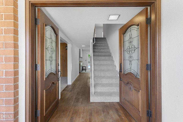 6421 Almar St, Simi Valley, CA 93063 - foyer featuring dark wood finished floors, stairway, and a textured ceiling