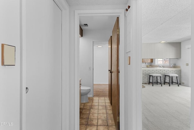 6421 Almar St, Simi Valley, CA 93063 - hallway with a textured ceiling and tile patterned flooring