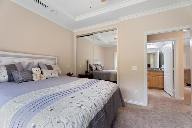 23406 Oakely Pl, Ramona, CA 92065 - bedroom featuring light carpet, a closet, crown molding, a tray ceiling, and baseboards