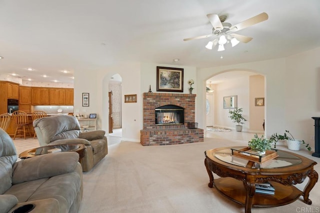 23406 Oakely Pl, Ramona, CA 92065 - living area featuring arched walkways, ceiling fan, recessed lighting, and light colored carpet