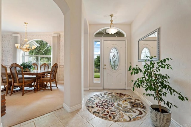 23406 Oakely Pl, Ramona, CA 92065 - foyer entrance featuring a chandelier, healthy amount of natural light, arched walkways, and light tile patterned flooring
