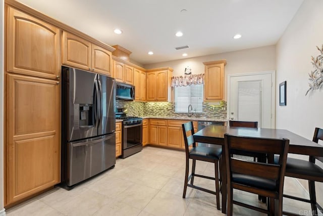 23406 Oakely Pl, Ramona, CA 92065 - kitchen featuring appliances with stainless steel finishes, decorative backsplash, a sink, recessed lighting, and light brown cabinetry