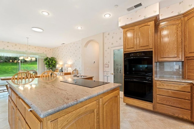 23406 Oakely Pl, Ramona, CA 92065 - kitchen with black appliances, wallpapered walls, arched walkways, a sink, and an island with sink