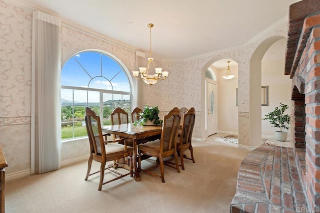 23406 Oakely Pl, Ramona, CA 92065 - dining space with arched walkways, wallpapered walls, light carpet, crown molding, and a chandelier
