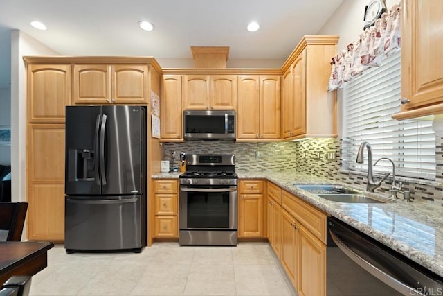 23406 Oakely Pl, Ramona, CA 92065 - kitchen featuring appliances with stainless steel finishes, light stone countertops, a sink, backsplash, and recessed lighting