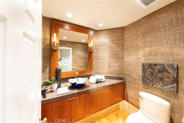 3 Harbor Ridge Dr, Newport Beach, CA 92660 - half bathroom featuring vanity, recessed lighting, and wood finished floors