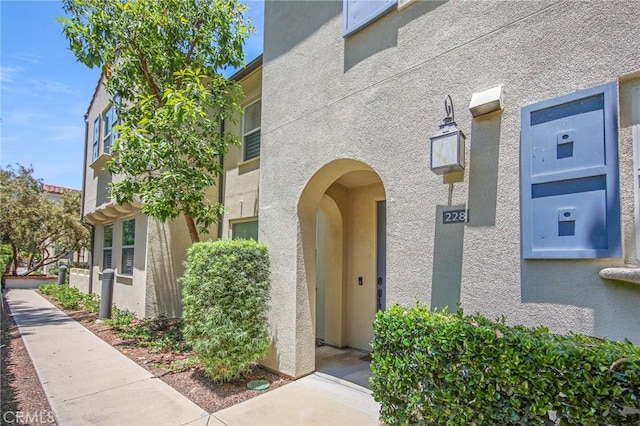 228 Borrego, Irvine, CA 92618 - doorway to property featuring stucco siding