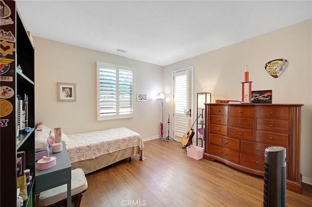 228 Borrego, Irvine, CA 92618 - bedroom featuring wood finished floors and baseboards