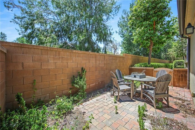 228 Borrego, Irvine, CA 92618 - fenced backyard with a patio area and outdoor dining area