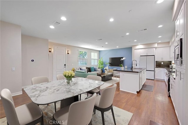 228 Borrego, Irvine, CA 92618 - dining room featuring light wood-style flooring and recessed lighting