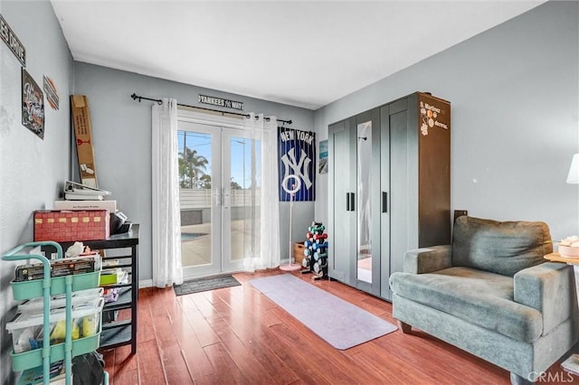1523 Lynton Ave, Wilmington, CA 90744 - sitting room featuring french doors and wood finished floors