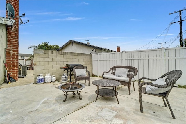 1523 Lynton Ave, Wilmington, CA 90744 - fenced backyard with a fire pit, a patio, and central AC
