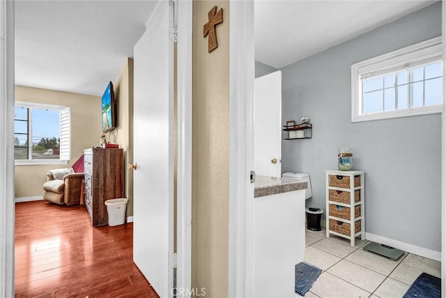 1523 Lynton Ave, Wilmington, CA 90744 - hall with baseboards and wood finished floors