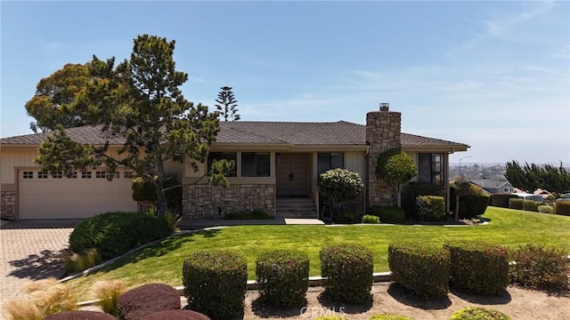 250 Coral Ct, Pismo Beach, CA 93449 - single story home featuring stone siding, an attached garage, a chimney, a front lawn, and driveway
