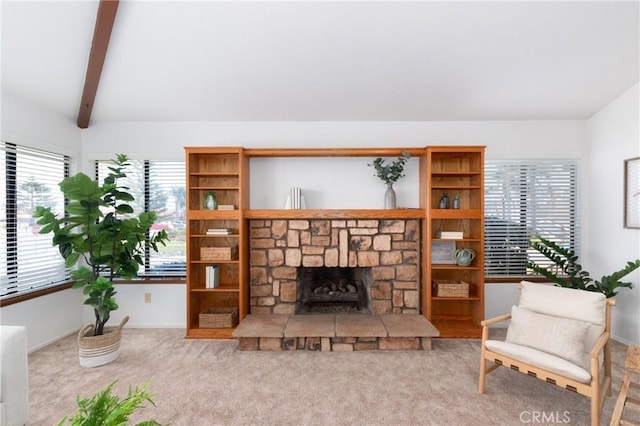 250 Coral Ct, Pismo Beach, CA 93449 - carpeted living area featuring a stone fireplace and beam ceiling