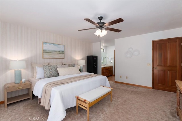 250 Coral Ct, Pismo Beach, CA 93449 - bedroom with wallpapered walls, connected bathroom, light carpet, and a ceiling fan