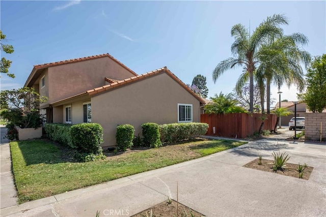 10546 Royal Oak Way, Stanton, CA 90680 - view of side of home with stucco siding and a tiled roof