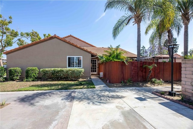 10546 Royal Oak Way, Stanton, CA 90680 - view of front facade featuring stucco siding, a tiled roof, and a patio