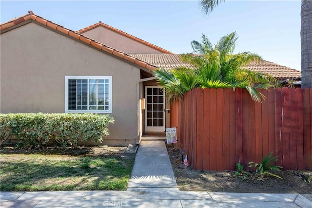 10546 Royal Oak Way, Stanton, CA 90680 - entrance to property featuring stucco siding and a tiled roof